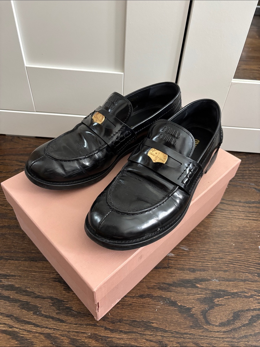 Miu Miu Black Leather Penny Coin Loafers with Gold Plaque